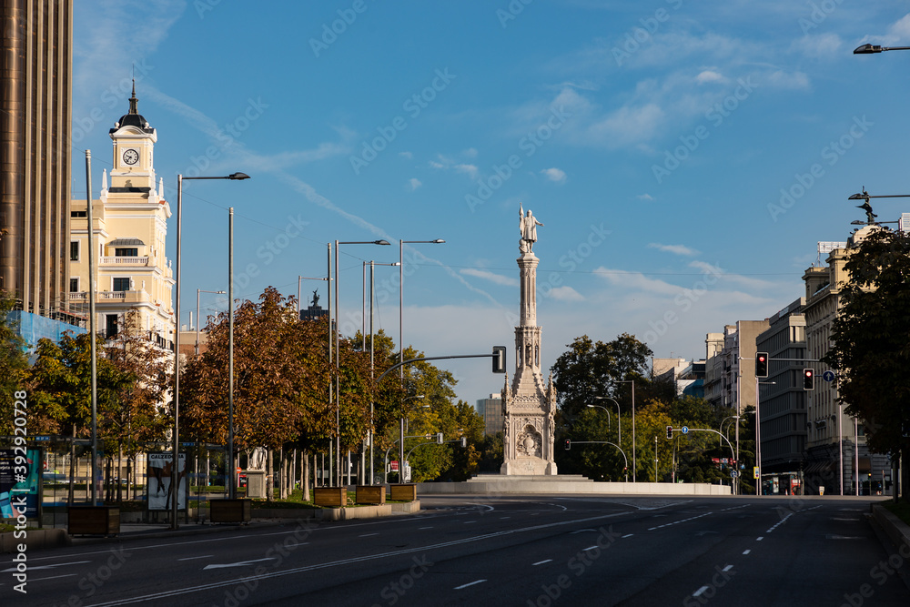 columbus square in madrid, on a sunday morning with no traffic or people passing through the street