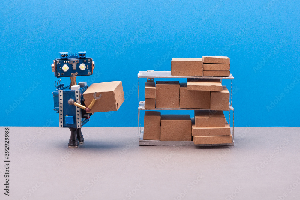 Fotografie Robot packer storekeeper sorts parcels on shelves
