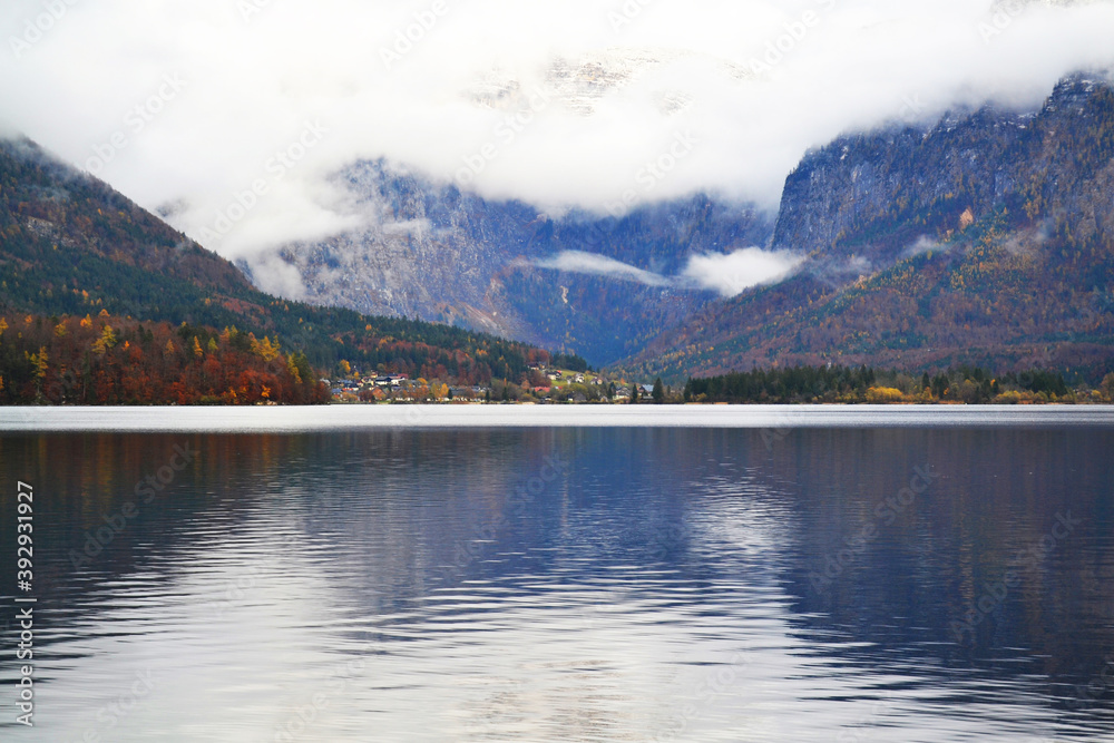 Hallstatt town view in a foggy day and clouds between the mountains. Austria, Salzkammergut