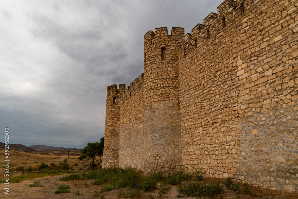 TIGRANAKERT CASTLE, NAGORNO-KARABAKH - October 5, 2018: .Outer wall of Tigranakert Castle in Nagorno Karabakh, Republic of Artsakh on a cloudy gray gloomy day