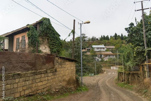 Typical street with yellow gas pipes and typical houses in the town of Hadrut part of the Janapar Trail in Nagorno Karabakh in the Republic of Artsakh photo