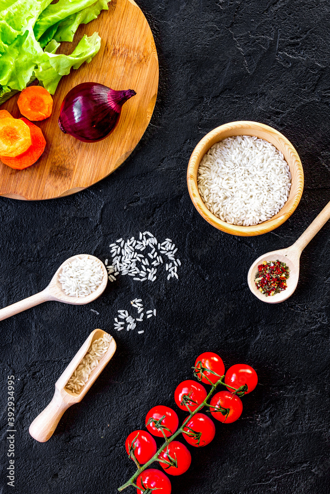 ingredients for paella on dark background top view