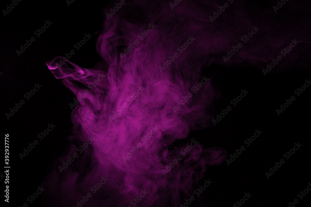 Colorful smoke close-up on a black background. Blurred pink cloud of smoke.