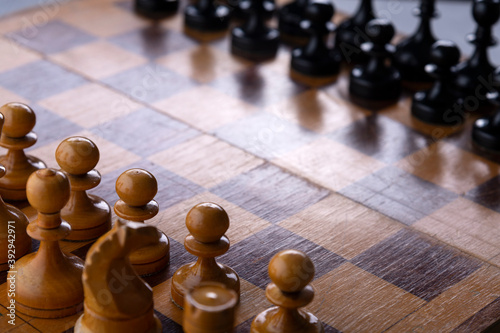 Chess board with black and white chess facing each other. Horizontal frame