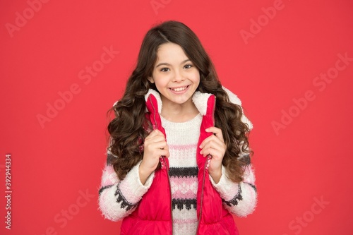 Winter activities. winter kid fashion. child with long curly hair in christmas aparrel. cold season activity style. childhood happiness. thermal clothing. happy teen girl wear warm clothes photo