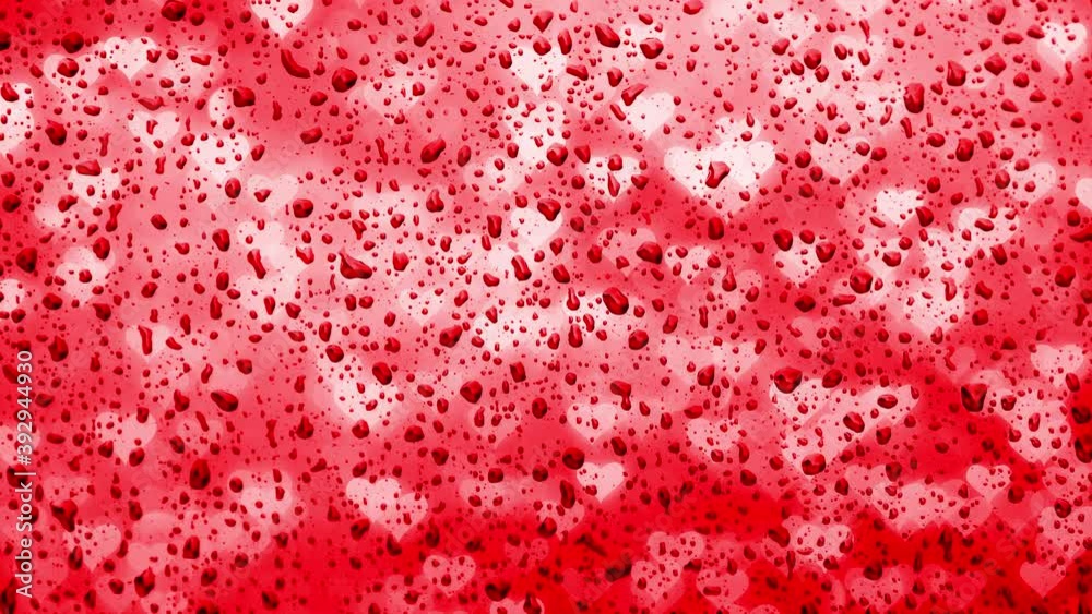 Emotional red coloured love heart symbol on wet rainy window background. Concept unhappy emotional background.