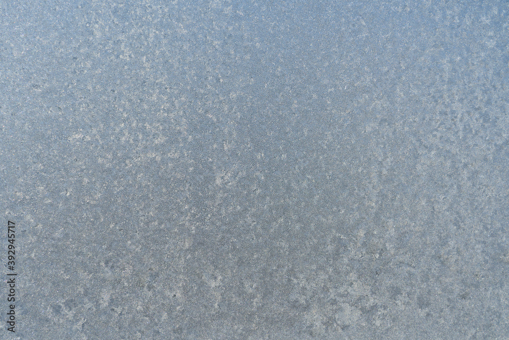 Frozen window glass covered with frost
