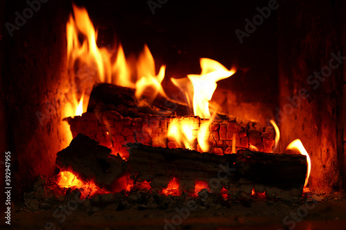 Wood is burning in the fireplace. Home comfort