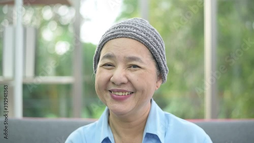 Headshot of smiling cancer woman in home