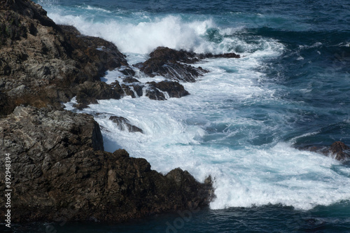 Fototapeta Naklejka Na Ścianę i Meble -  Ocean waves crashing onto a rocky shore