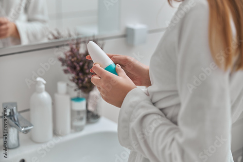 Young female with natural healthy fresh skin at home bathroom