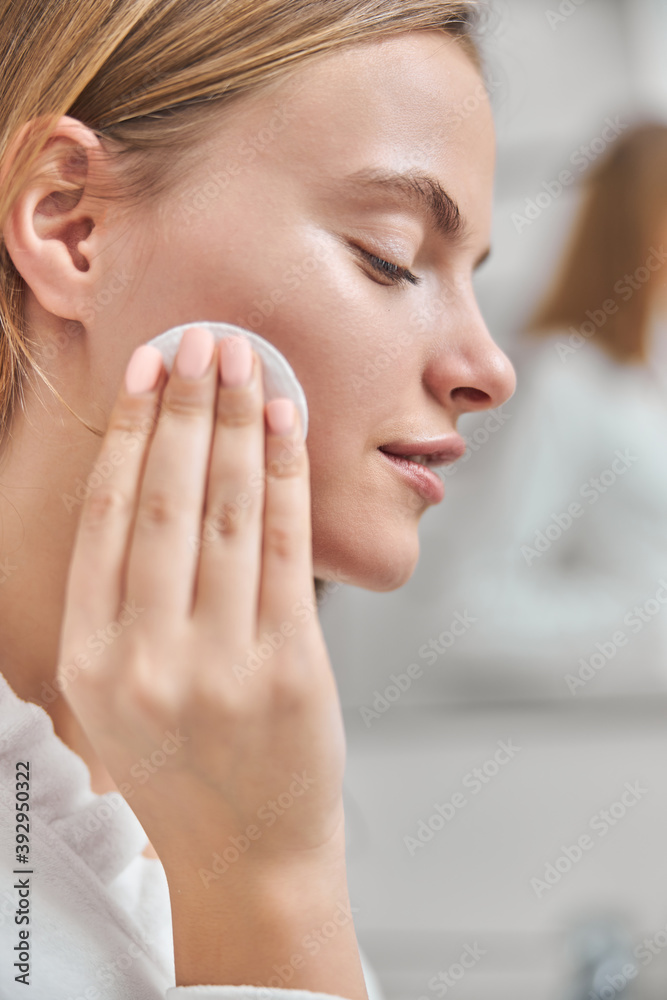 Young female with natural healthy fresh skin at home bathroom Young female with natural healthy fresh skin at home bathroom