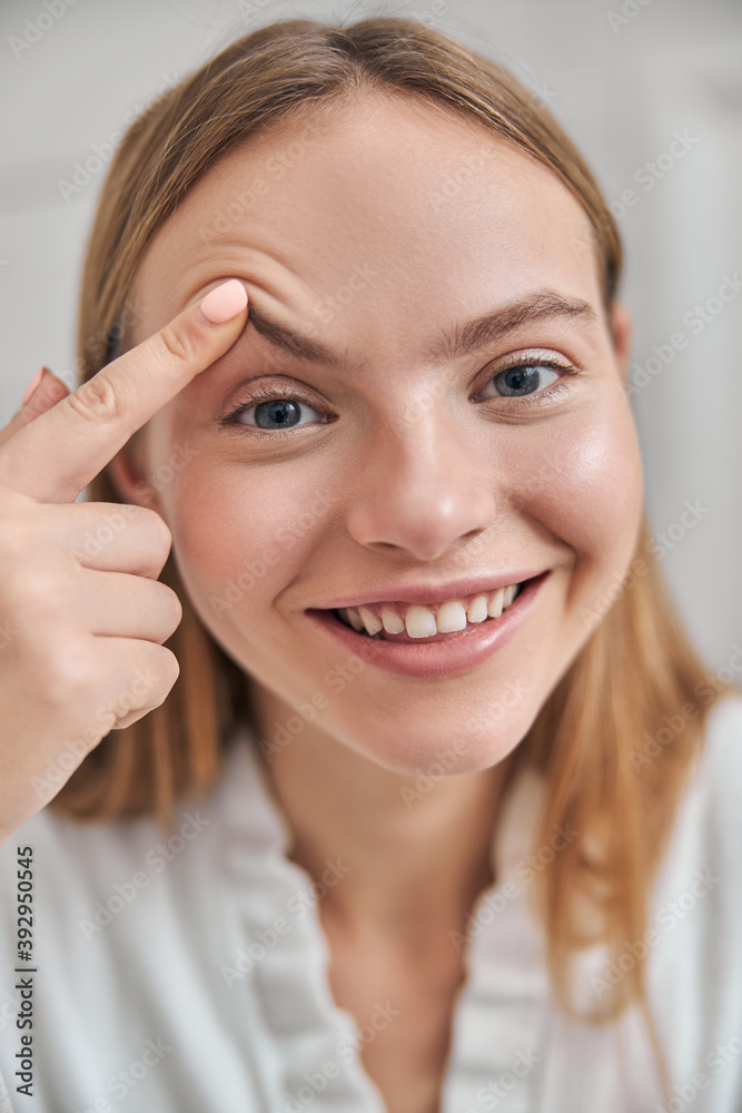 Young female with natural healthy fresh skin at home bathroom Young female with natural healthy fresh skin at home bathroom