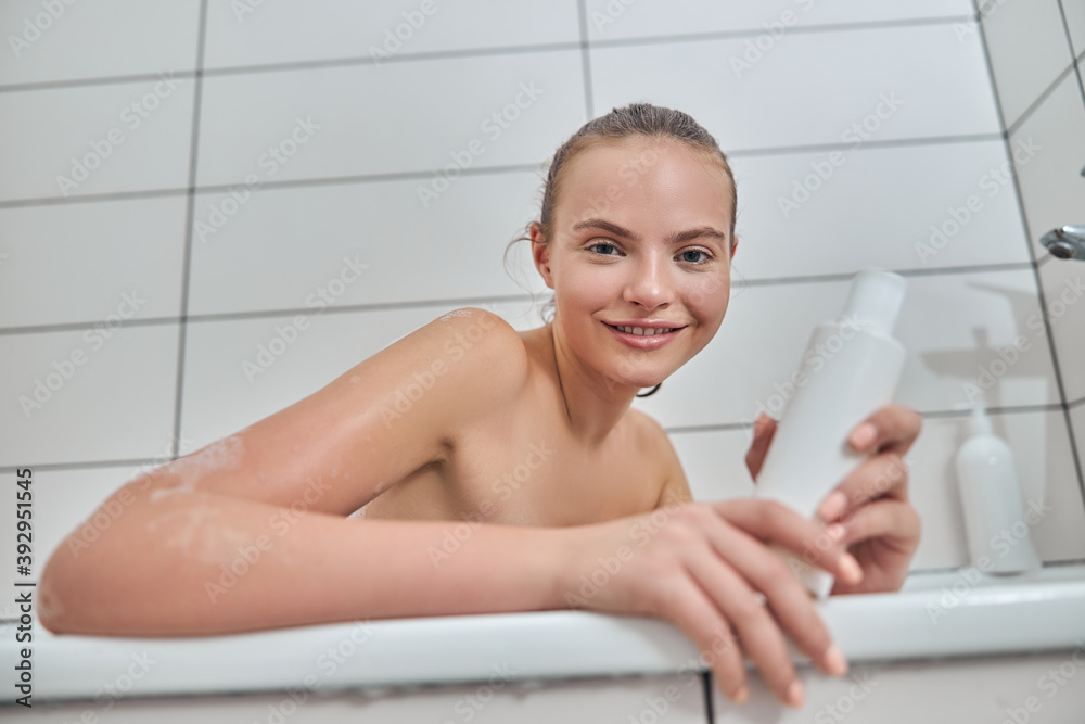 Obraz premium Young female with natural healthy fresh skin at home bathroom