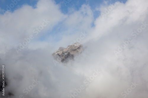Teton mountains with a storm cloud