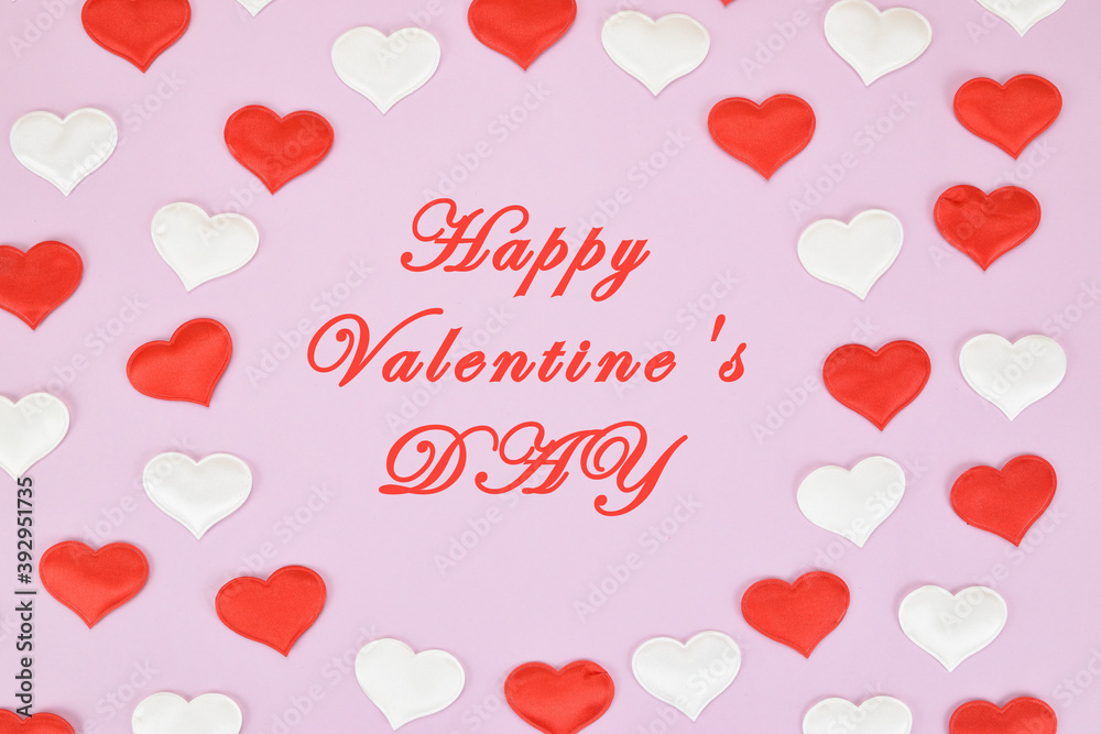 Red and white hearts on a pink background around the congratulation to everyone in love