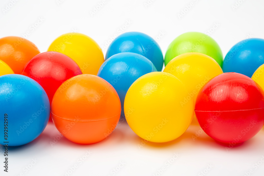 Colored plastic balls on white background. leisure and game items. round objects Colored plastic balls on white background. leisure and game items. round objects