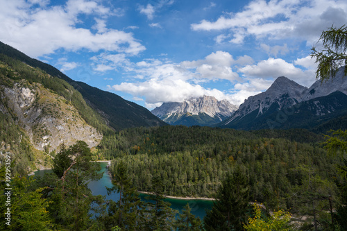 Panoramic view from the Rest Area "Zugspitzblick" at the Fernpass alpine road to the Zugspitze Mountain and Lake Blindsee, in Ausrria. Beautiful mountain scenery in Alps.