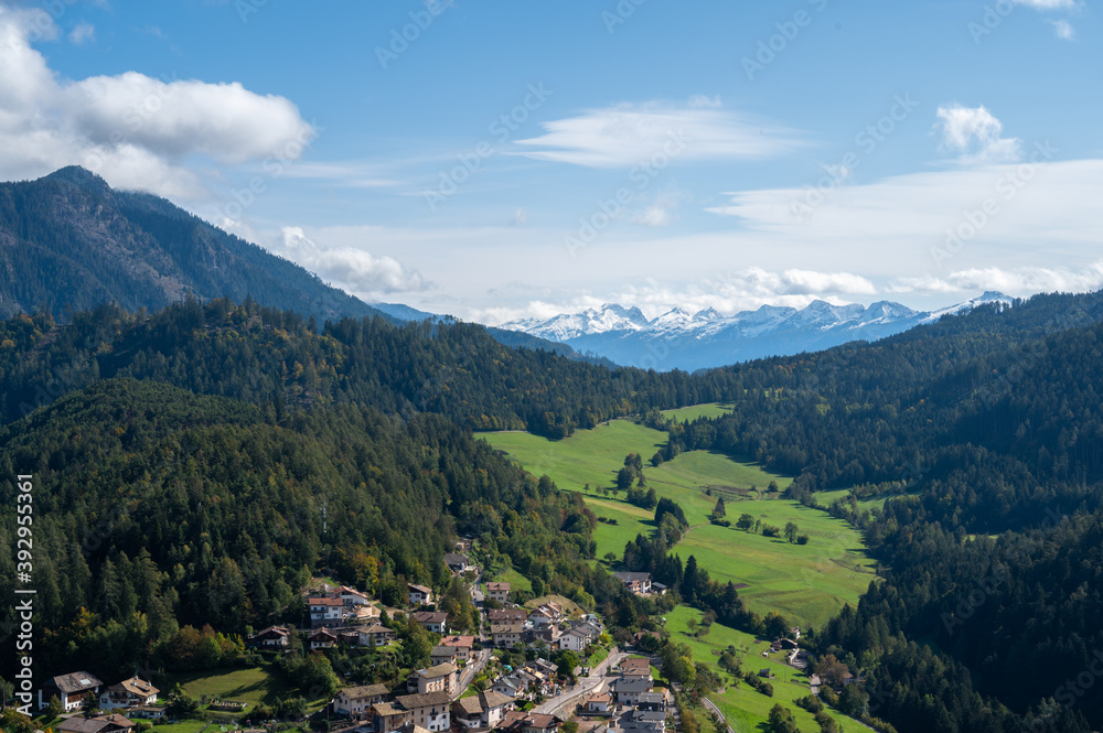 Aerial View alp mountains In South Tyrol region in Italy with a village in the valey.