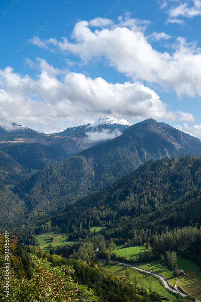 Aerial View alp mountains In South Tyrol region in Italy with a road in the valey.