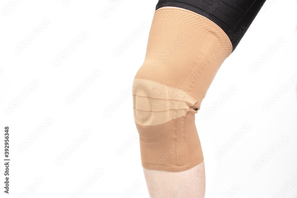 bandage for fixing the injured knee of the leg. medicine and sports. limb injury treatment bandage for fixing the injured knee of the leg. medicine and sports. limb injury treatment