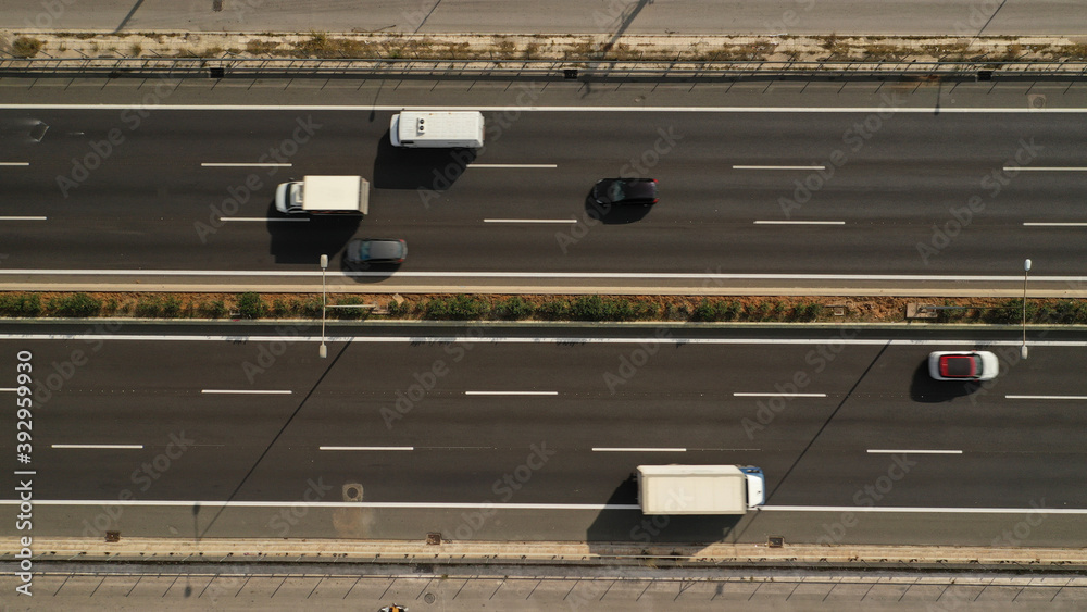 Aerial drone top down photo of urban National road with light traffic Aerial drone top down photo of urban National road with light traffic