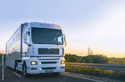 hydrogen fueled truck on the road driving. h2 combustion Truck engine for emission free ecofriendly transport.