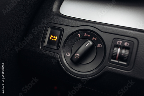 Headlights control panel in car © Moose