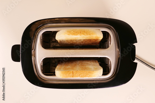 Close up of toaster with two slices of toast