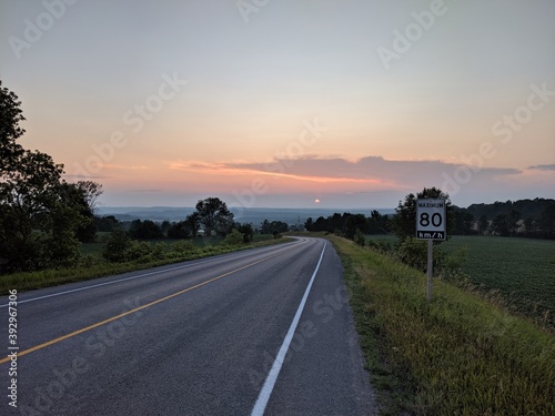 Sunset roadway 80 km speed limit