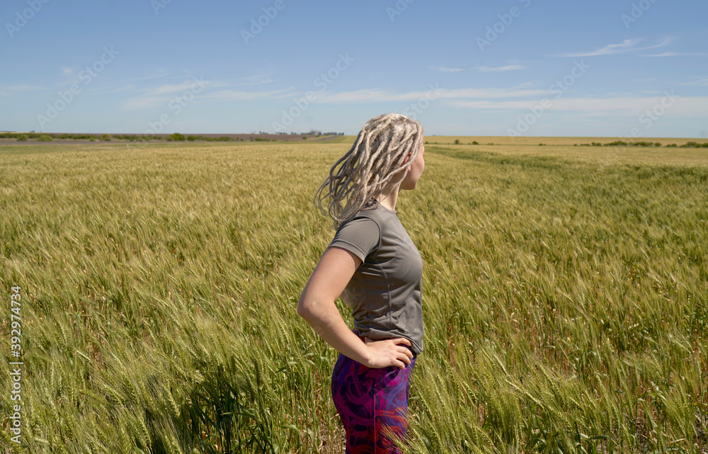 Woman Enjoying The Nature In A Wheat Field Woman Enjoying The Nature In A Wheat Field