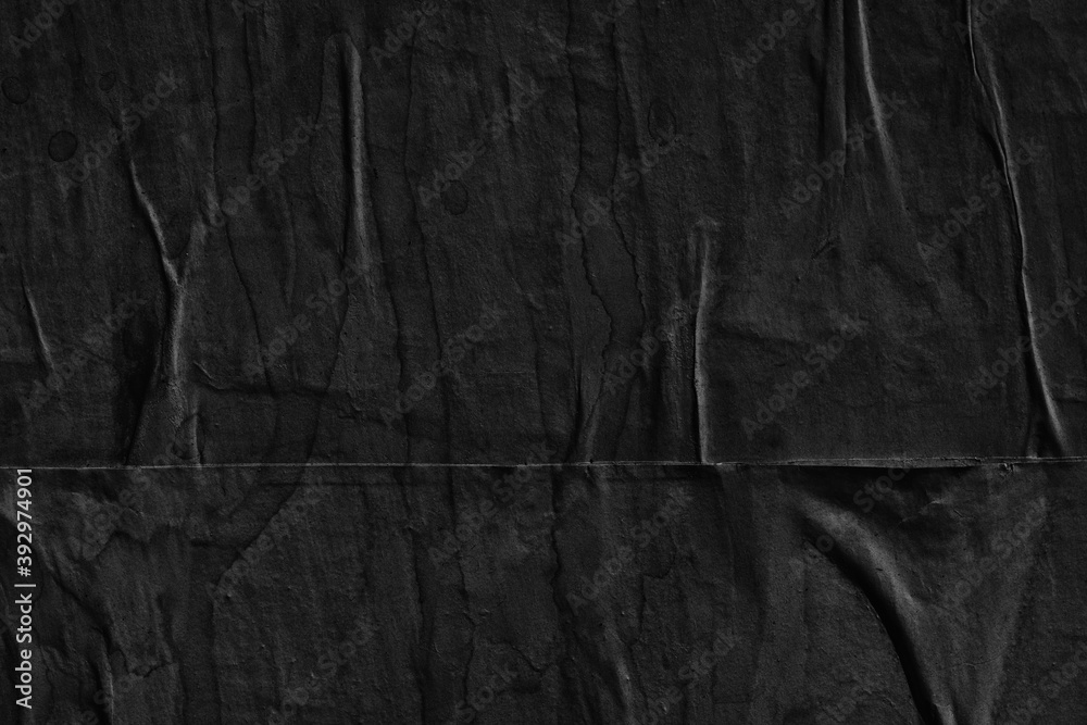 Black grey paper background creased crumpled surface / Old torn ripped posters scary grunge textures  