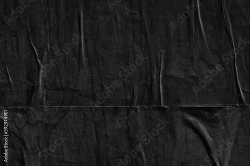 Black grey paper background creased crumpled surface / Old torn ripped posters scary grunge textures  