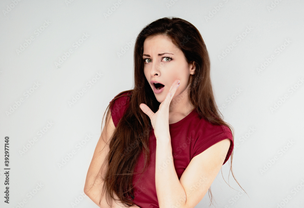 Surprised beautiful casual woman with opened mouth and big eyes looking happy. Closeup portrait Surprised beautiful casual woman with opened mouth and big eyes looking happy. Closeup portrait