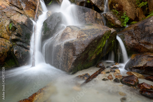 Water flows over and between rocks in Bells Canyon in the Wasatch Mtns photo