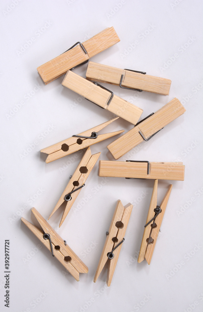 Wooden clothes pin. Closeup pin set on white background Wooden clothes pin. Closeup pin set on white background