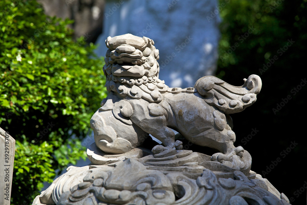 Stone sculpture of an Asian lion in one of the ancient temples of Vietnam, in the city of Chiang Mai