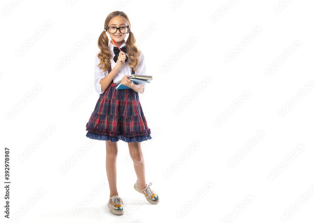 Schoolgirl girl in glasses, stands in full growth, isolated on a white background. Copy space for text about training. Schoolgirl girl in glasses, stands in full growth, isolated on a white background. Copy space for text about training.