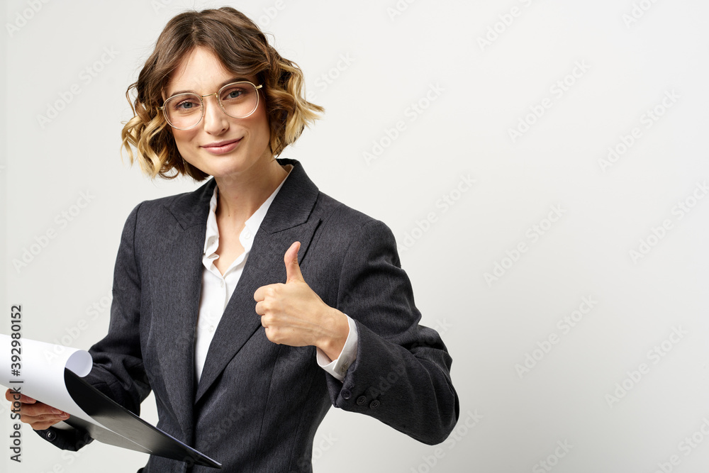 Woman in business suit finances work documents glasses hairstyle Woman in business suit finances work documents glasses hairstyle
