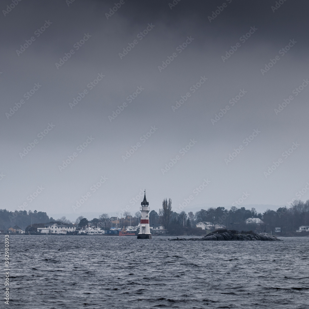 Light house in Oslo Fjord on a stormy dark day.
