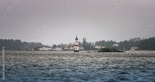 Photography light house in Oslo Fjord on a stormy dark day.