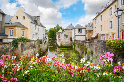 Fototapeta Naklejka Na Ścianę i Meble -  The colorful, picturesque French town of Bayeux France near the coast of Normandy with medieval houses overlooking the River Aure.