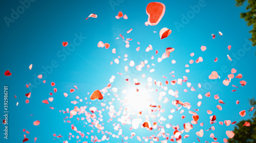 BOTTOM UP: Heart shaped confetti fall from the sky during gender reveal party © helivideo