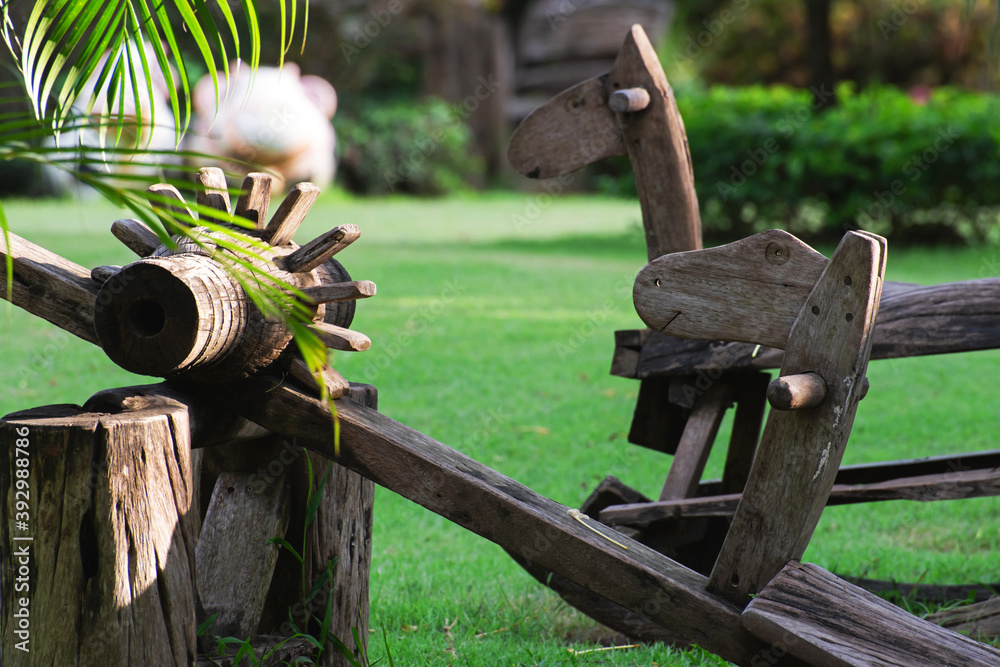 Children's play equipment made of wood are in the garden. Children's play equipment made of wood are in the garden.