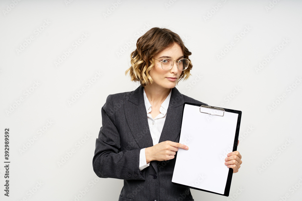 Woman in business suit finances work documents glasses hairstyle Woman in business suit finances work documents glasses hairstyle