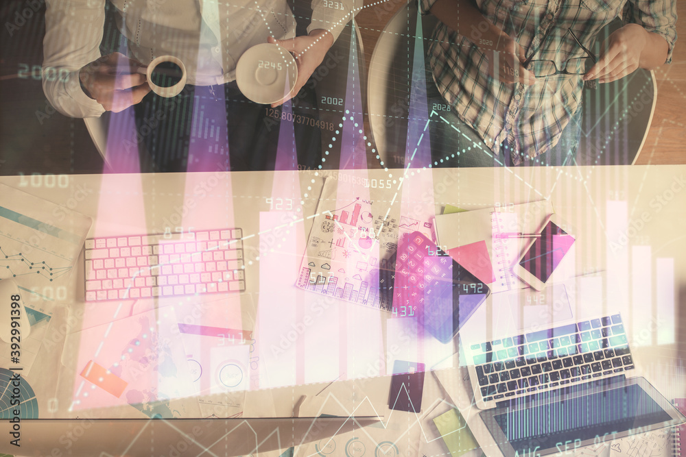 Double exposure of man and woman working together and financial chart hologram drawing. market analysis concept. Computer background. Top View. Double exposure of man and woman working together and financial chart hologram drawing. market analysis concept. Computer background. Top View.