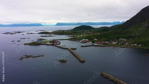 Aerial view towards the Sto village at the end of the Vesteralen islands, overcast day, in North Norway - dolly, drone shot photo