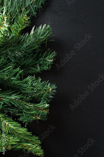 Christmas new year composition on black background. Fir branches  christmas decoration. Flat lay  top view  copy space