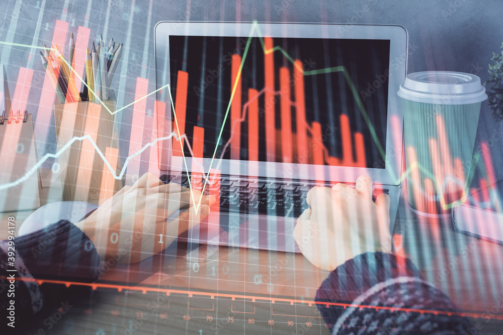Double exposure of woman hands typing on computer and forex chart hologram drawing. Stock market invest concept. Double exposure of woman hands typing on computer and forex chart hologram drawing. Stock market invest concept.