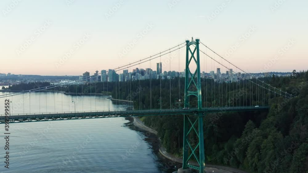 Drone Aerial Shot Flying away from the Vancouver Lions Gate Bridge with the cityscape in the background Drone Aerial Shot Flying away from the Vancouver Lions Gate Bridge with the cityscape in the background